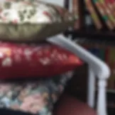 european-pillows-stacked-in-chair.JPG