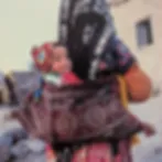 Turkish-Child-carried-by-mother.jpg