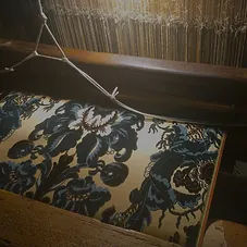 Blue-woven-fabric-on-loom.jpg