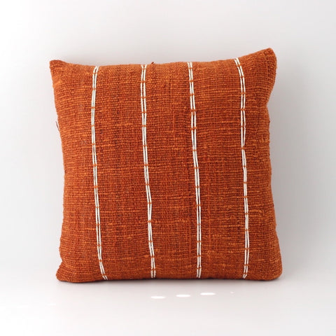 orange throw pillow handcrafted in bali from cotton with stripe designs