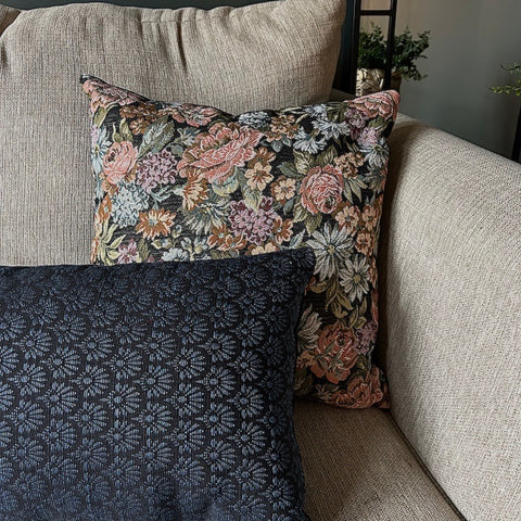 close up image of blue lumbar throw pillow on living room sofa