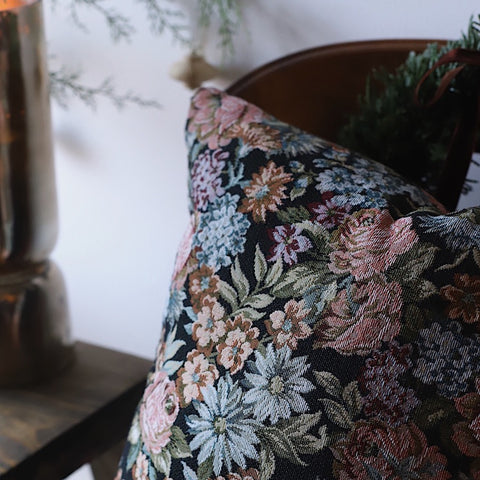 close up of the floral tapestry design on a french woven decorative throw pillow