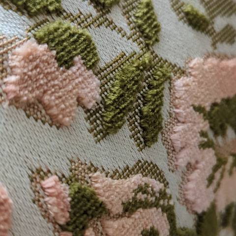 close up image of the velvet on a velvet floral pillow cushion